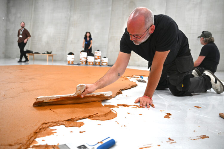 Dutch museum honors late artist by covering floor in peanut butter